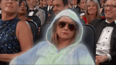 Woman In Hoodie And Sunglasses Sitting GIF