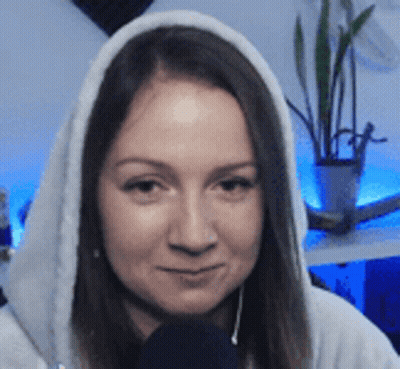 Woman In Hoodie Smiling With Microphone GIF