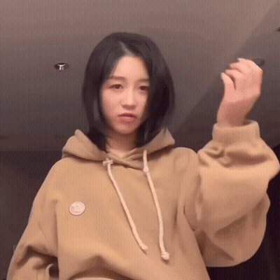 Woman In Hoodie With Smiley Face GIF