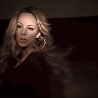Woman In Hoop Earrings And Black Shirt GIF