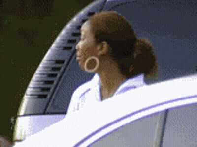 Woman In Hoop Earrings Looking Out Car Window GIF
