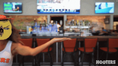 Woman In Hooters Shirt At Bar GIF