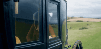 Woman In Horse Drawn Carriage Looking Out Window GIF