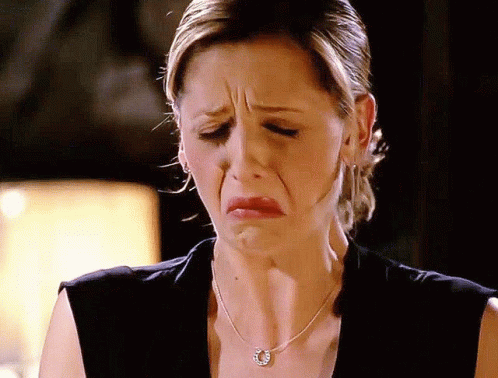 Woman In Horseshoe Necklace Making Funny Face GIF