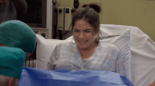 Woman In Hospital Bed With Nurse GIF