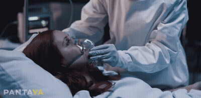 Woman In Hospital Bed With Oxygen Mask GIF