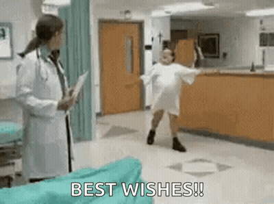 Woman In Hospital Gown Dancing In Front Of Doctor GIF