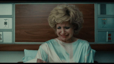 Woman In Hospital Gown Holding Baby And Crying GIF