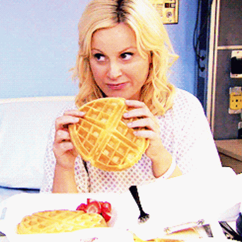 Woman In Hospital Gown Holding Waffle GIF