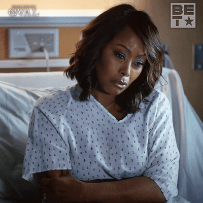 Woman In Hospital Gown With BET Logo GIF