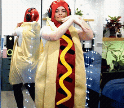Woman In Hot Dog Costume With Mustard GIF
