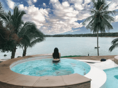 Woman In Jacuzzi Overlooking Ocean GIF