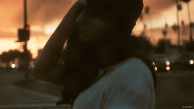 Woman In James Hat At Sunset GIF