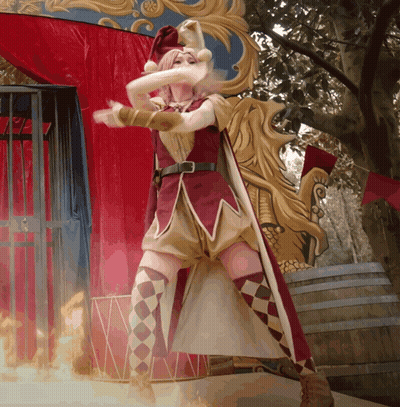 Woman In Jester Costume In Front Of Fire Barrel GIF