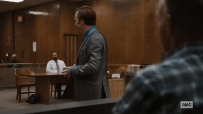 Woman In Judge Robe At Desk With Equity Seal GIF