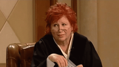 Woman In Judge Robe Holding Paper GIF