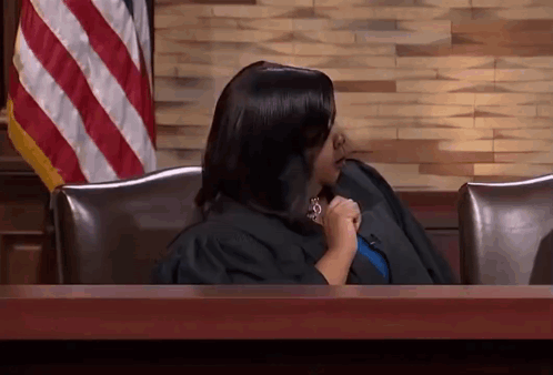 Woman in Judge's Robe at Desk