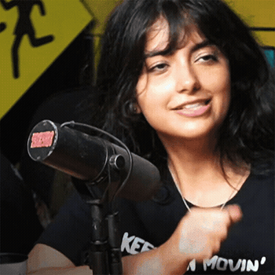 Woman In Kef Shirt At Microphone GIF