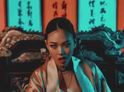 Woman In Kimono In Front Of Wall With Chinese Writing GIF