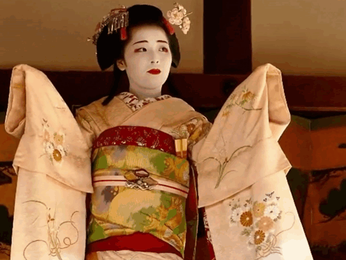 Woman In Kimono With Fan On Sleeve GIF
