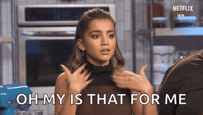 Woman In Kitchen Hands On Chest GIF