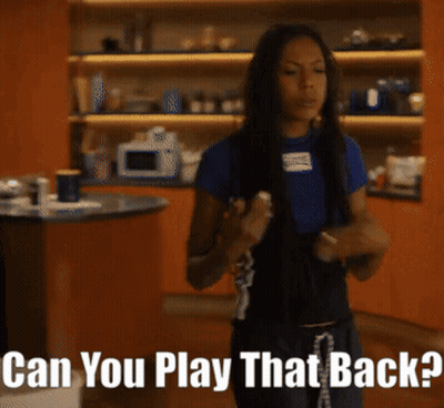 Woman In Kitchen Saying Can You Play That Back GIF