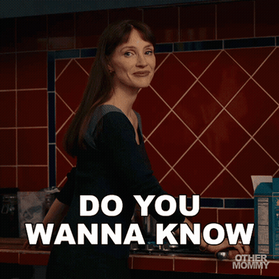 Woman In Kitchen Saying Something Silly GIF