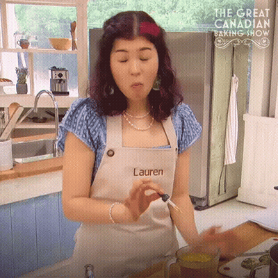Woman In Kitchen Wearing Apron Saying Lauren GIF