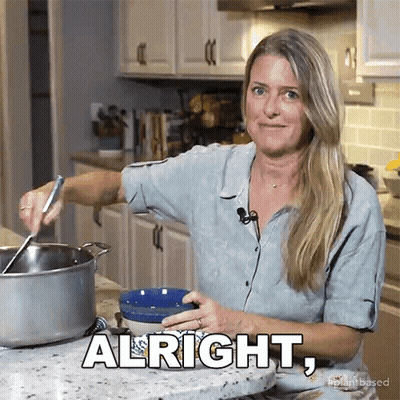 Woman In Kitchen With Alright On Counter GIF