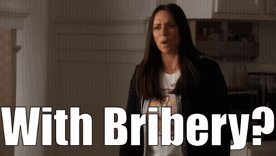 Woman in Kitchen With Bribery
