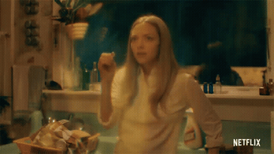 Woman In Kitchen With Netflix Logo GIF