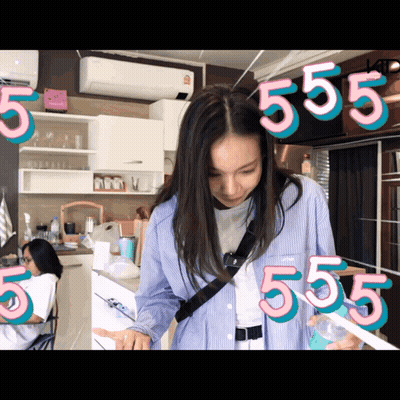 Woman In Kitchen With Number 555 GIF