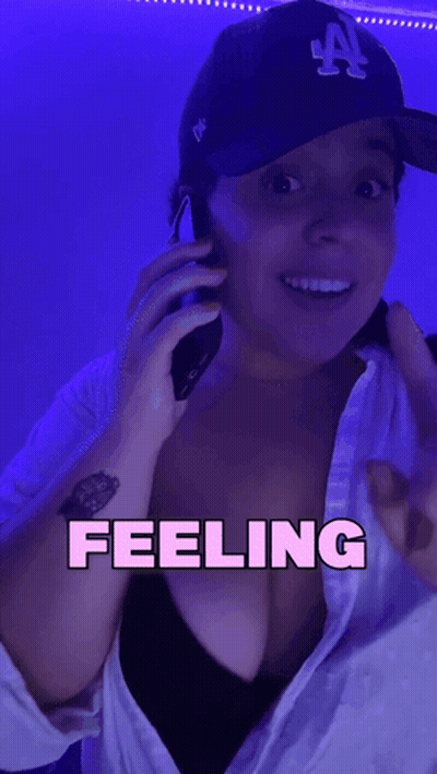 Woman In LA Hat Talking On Phone GIF