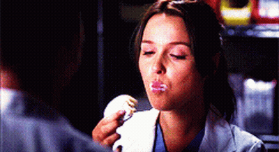 Woman In Lab Coat Eating Cake GIF