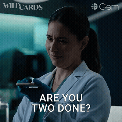 Woman In Lab Coat Holding Cell Phone Asking Are You Two Done GIF