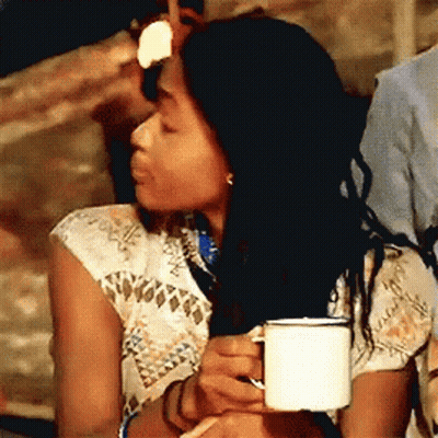 Woman In Lab Coat Holding Coffee And Saucer GIF