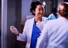 Woman In Lab Coat Hugging Another Woman GIF