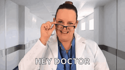 Woman In Lab Coat Saying Hey Doctor GIF
