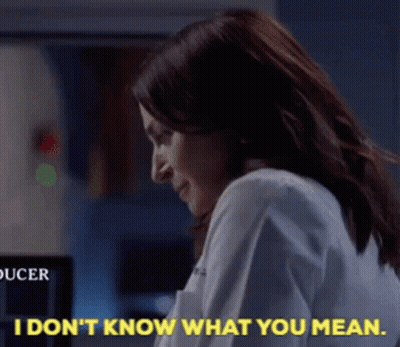 Woman In Lab Coat Saying I Don't Know What You Mean GIF
