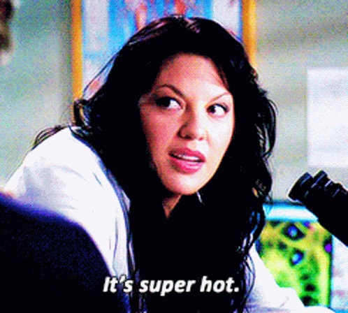 Woman In Lab Coat Saying It's Super Hot GIF