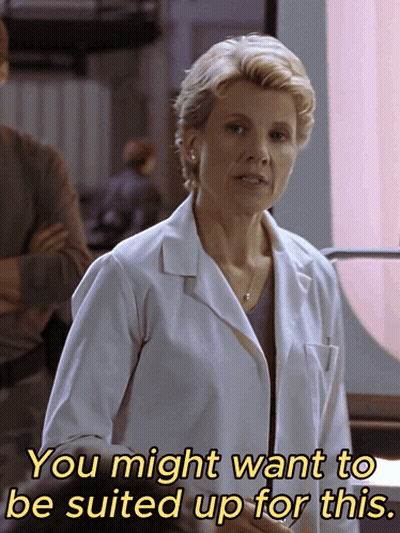 Woman In Lab Coat Saying You Might Want To Be Suited Up For This GIF