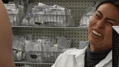 Woman In Lab Coat Smiling Beside Basket Labeled B GIF