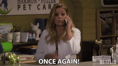 Woman In Lab Coat Talking On Phone GIF