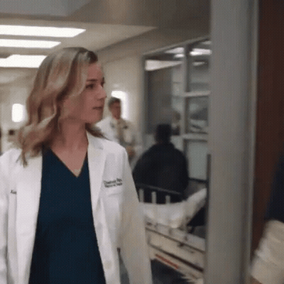 Woman In Lab Coat Walking Beside Stretcher GIF