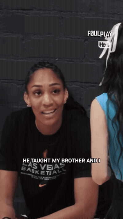 Woman In Las Vegas Basketball Shirt Talking To Another GIF