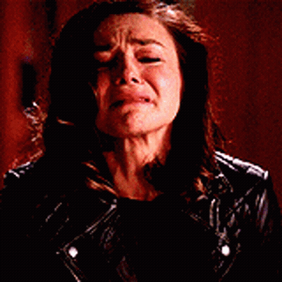 Woman In Leather Jacket Crying With Mouth Open GIF