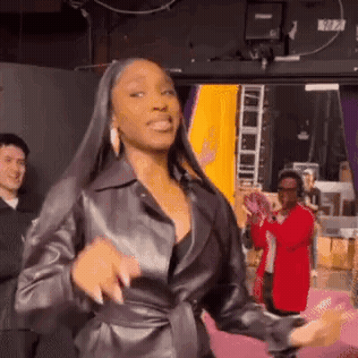 Woman In Leather Jacket Dancing GIF