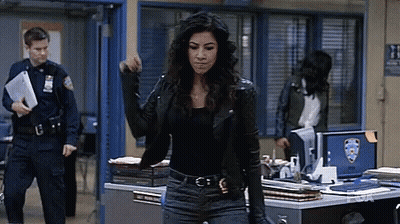 Woman In Leather Jacket Facing Police Officer GIF