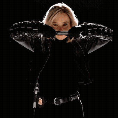 Woman In Leather Jacket Holding Gun GIF