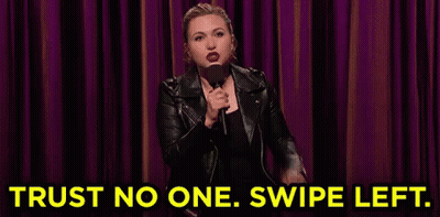 Woman in Leather Jacket Holding Microphone Saying Trust No One Swipe Left